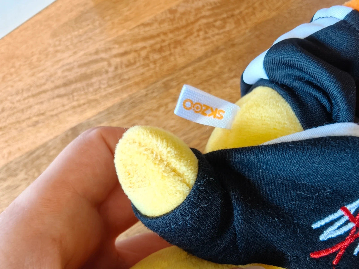 Stray Kids SKZOO BbokAri Plush, close-up of the plush wing and fabric label