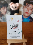 Stray Kids Seungmin THE VICTORY Photocard (White Shirt - Seated Portrait) — THE VICTORY reverse design