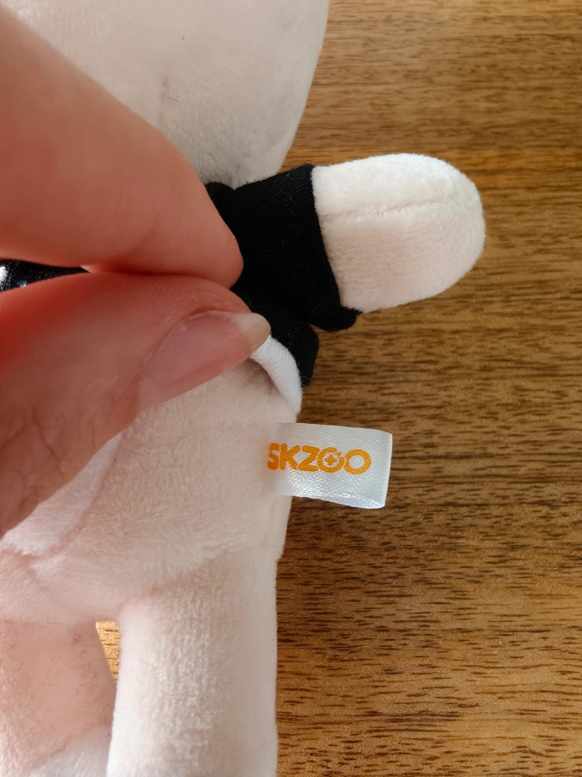 Stray Kids SKZOO FoxI.Ny Plush, close-up of the plush arm and fabric label