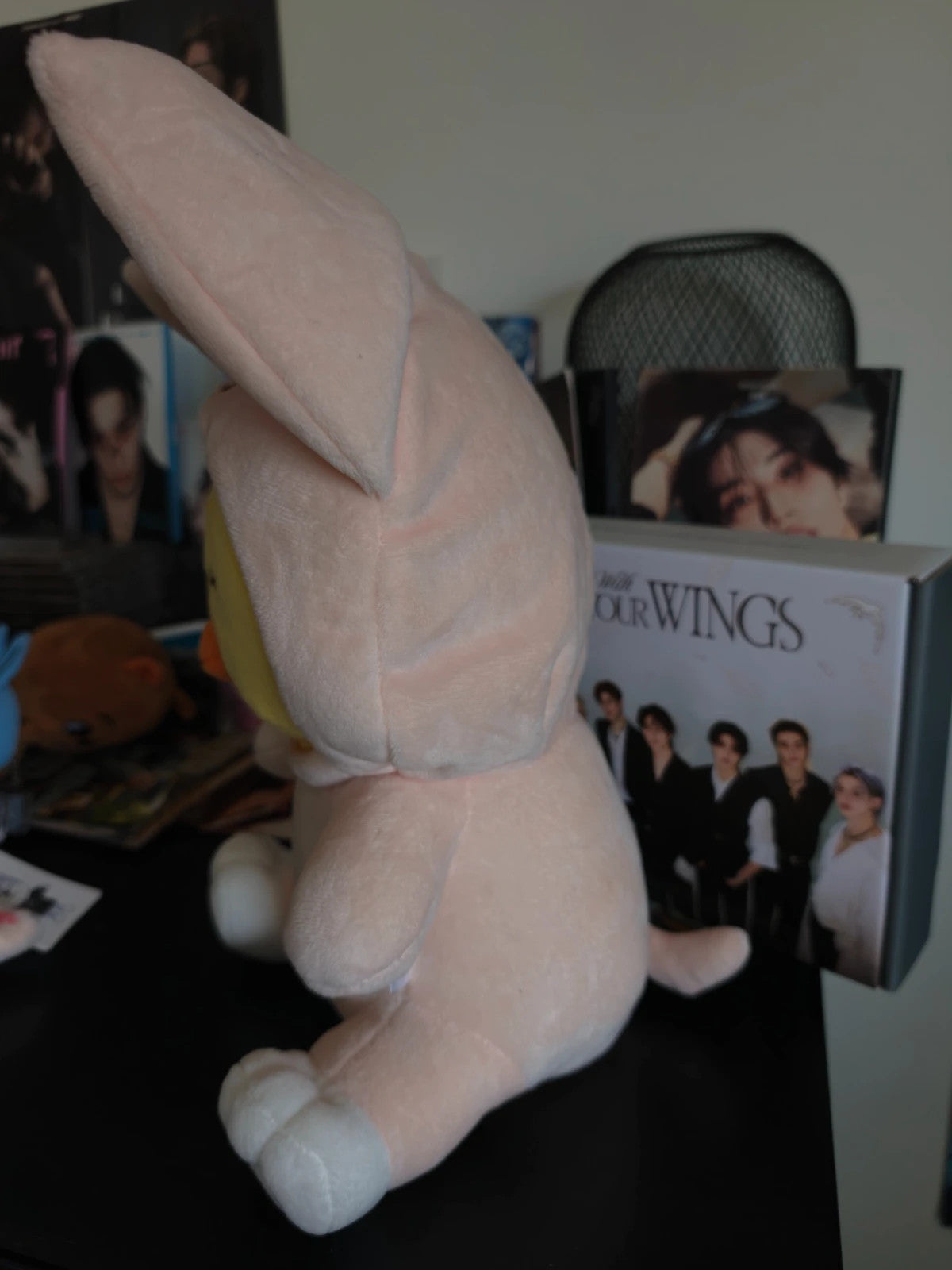 Stray Kids SKZOO BbokAri Plush (TOY WORLD, FoxI.Ny Suit), side view showing the hood and tail