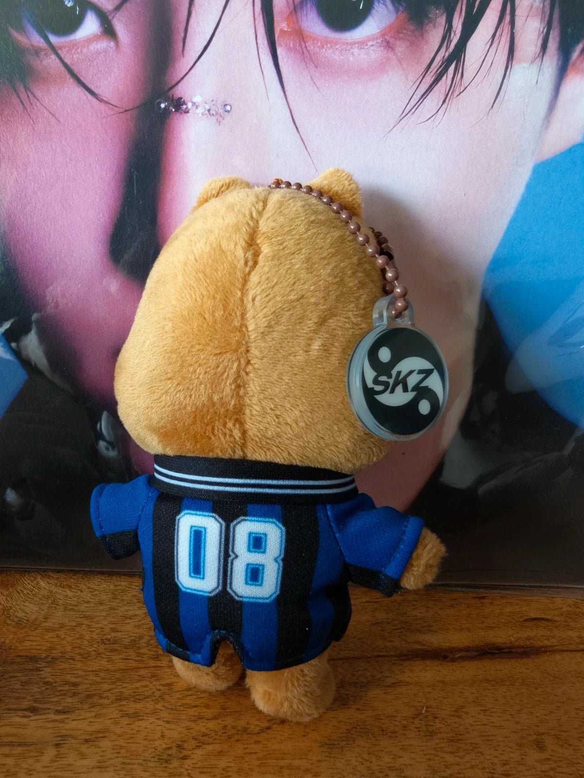 Stray Kids SKZOO HAN QUOKKA Plush Keyring (KARMA Evil), back of the plush in a blue number 08 outfit