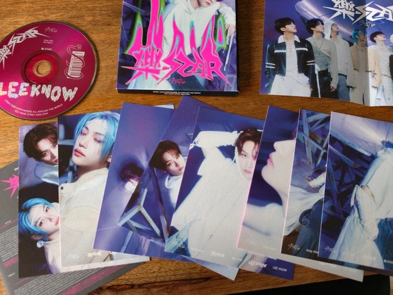 Stray Kids Lee Know ROCK-STAR Album (Postcard Ver.), CD and printed inclusions arranged on a table