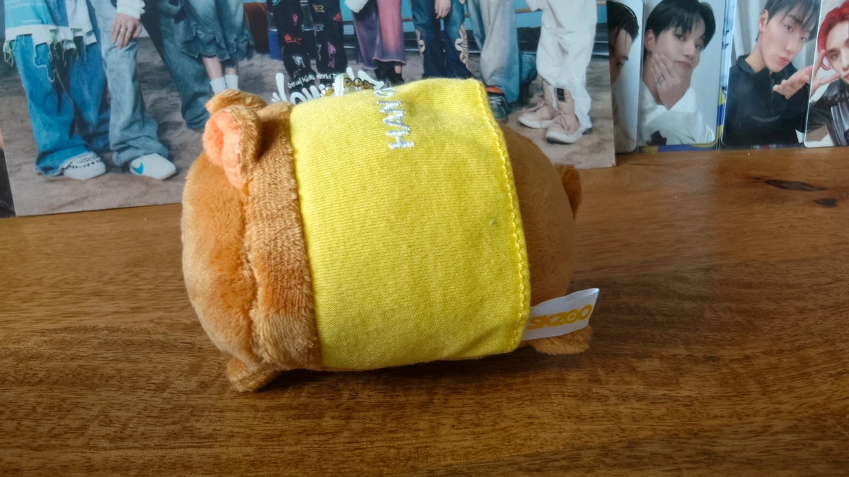 Stray Kids SKZOO HAN QUOKKA Plush Keyring, underside of the round plush in a yellow outfit