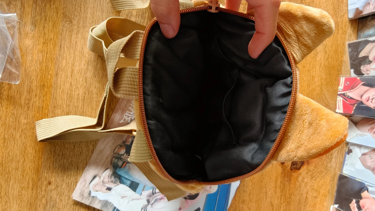 Stray Kids SKZOO HAN QUOKKA Mini Backpack (TOY WORLD), open backpack showing the black lining