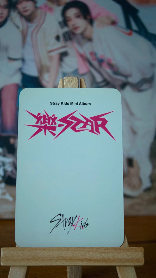 Stray Kids Felix ROCK-STAR Photocard (Red Jacket Finger-heart Portrait) — printed reverse design