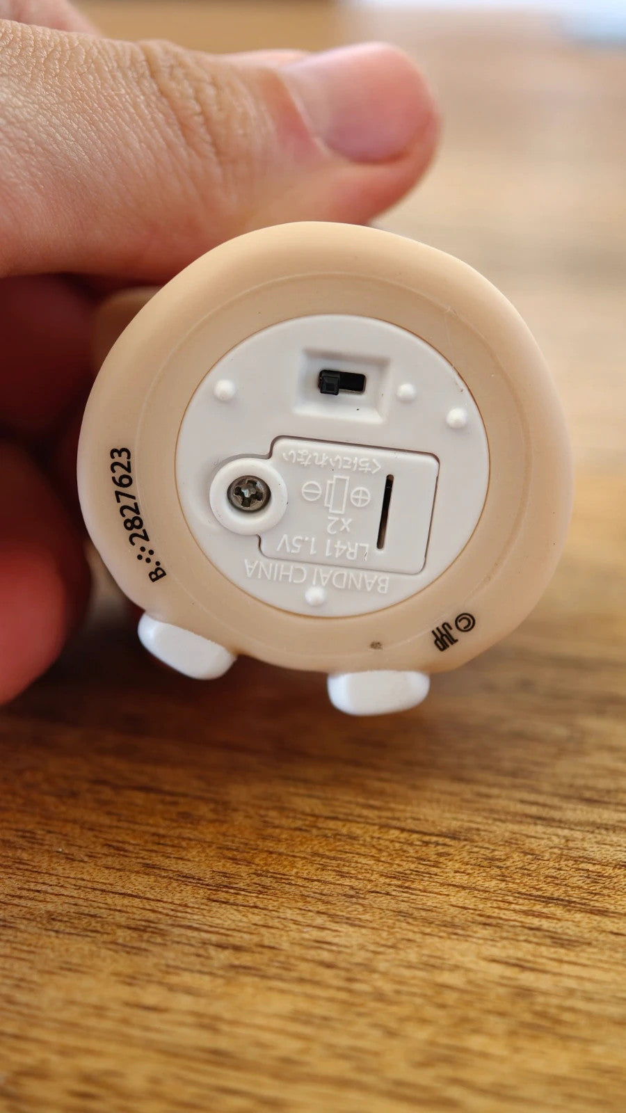 Stray Kids SKZOO PuppyM Gacha Light, underside showing switch and battery compartment