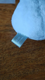 Stray Kids SKZOO HAN QUOKKA Face Keyring (Silver Ver.), close-up of the fabric label