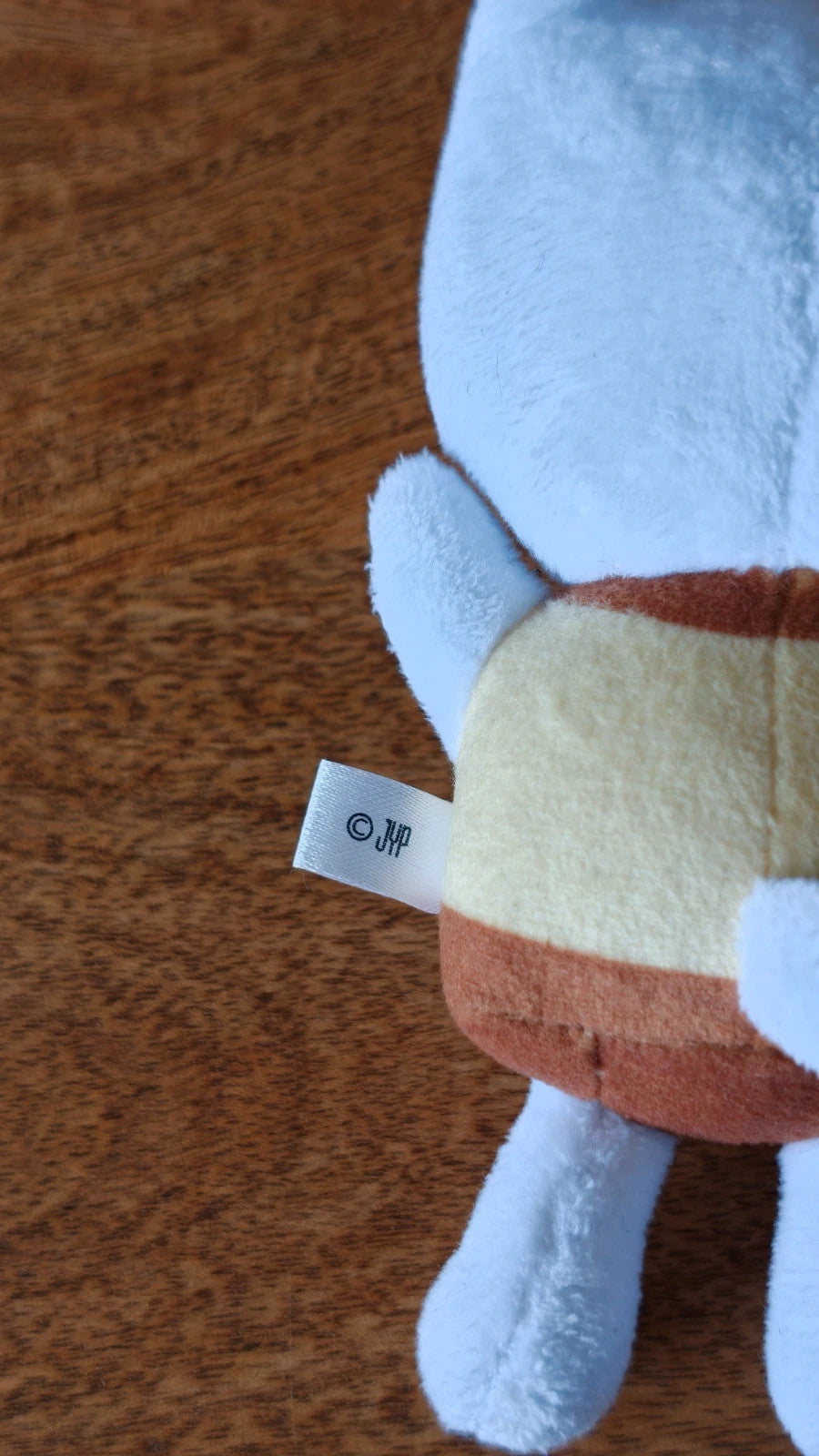 Stray Kids SKZOO Jiniret Plush Keyring, close-up of the outfit and fabric label