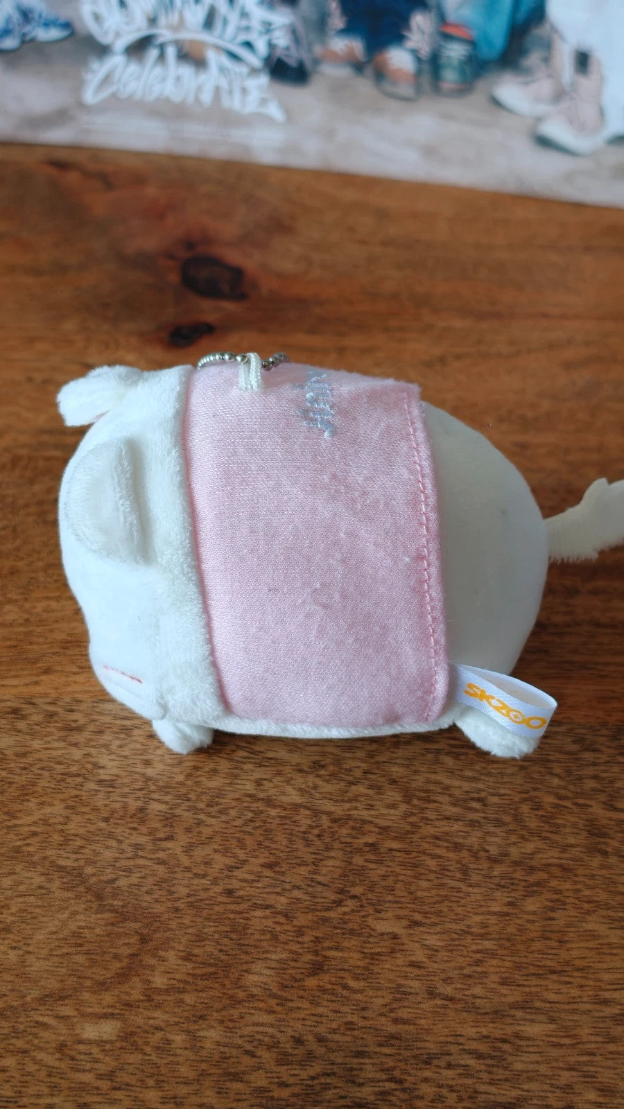 Stray Kids SKZOO Jiniret Plush Keyring, underside of the round plush in a pink outfit