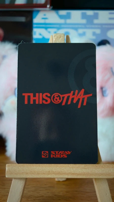 Stray Kids Lee Know THIS & THAT Lenticular Photocard (FANS Album Ver.), reverse of the lenticular photocard with THIS & THAT logo