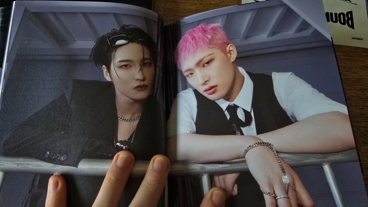 ATEEZ THE WORLD EP.2 : OUTLAW Album, open photobook showing two member portraits