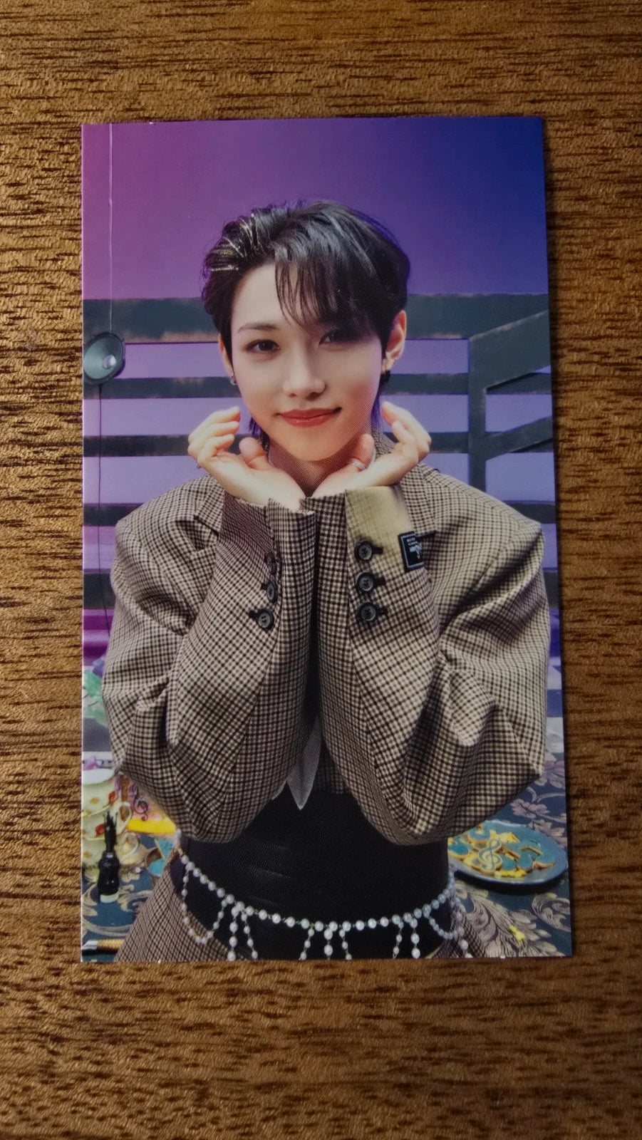Stray Kids The Sound Photocard Felix, portrait with hands beneath chin against a purple background