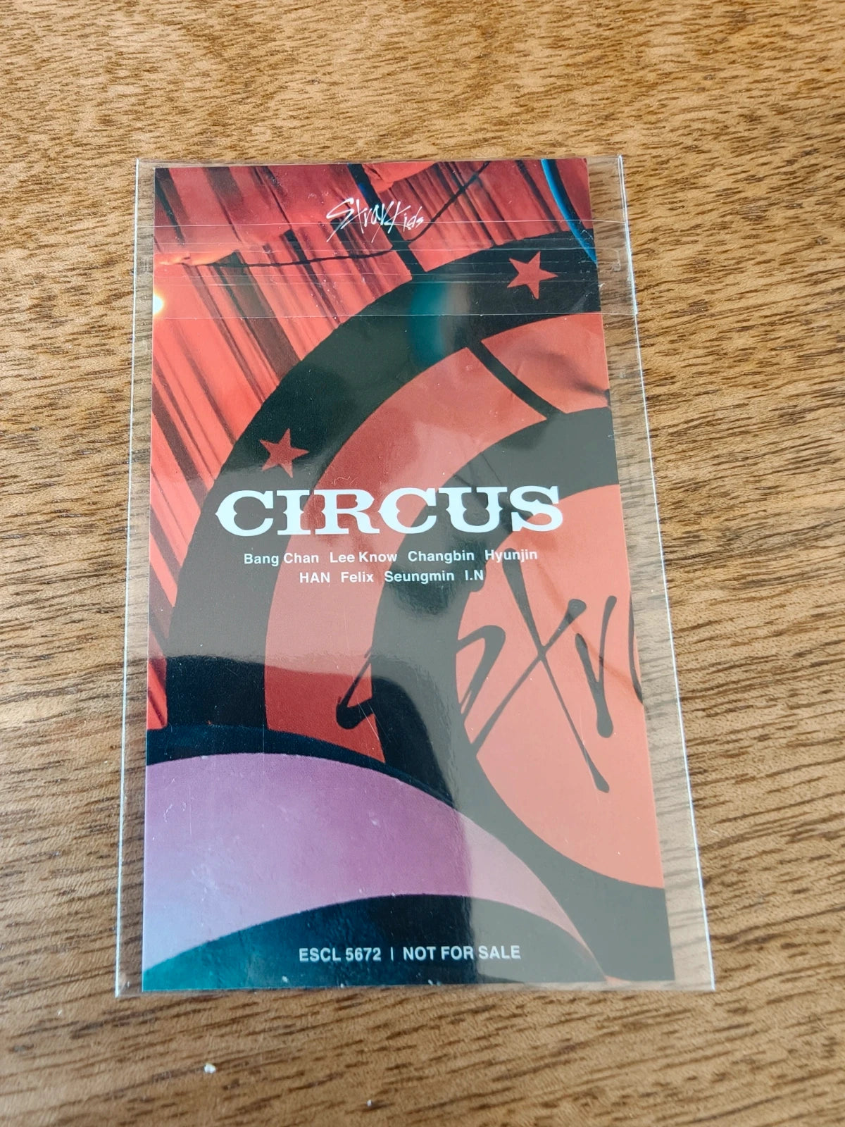 Stray Kids Circus Photocard Felix, red-and-black reverse with CIRCUS logo