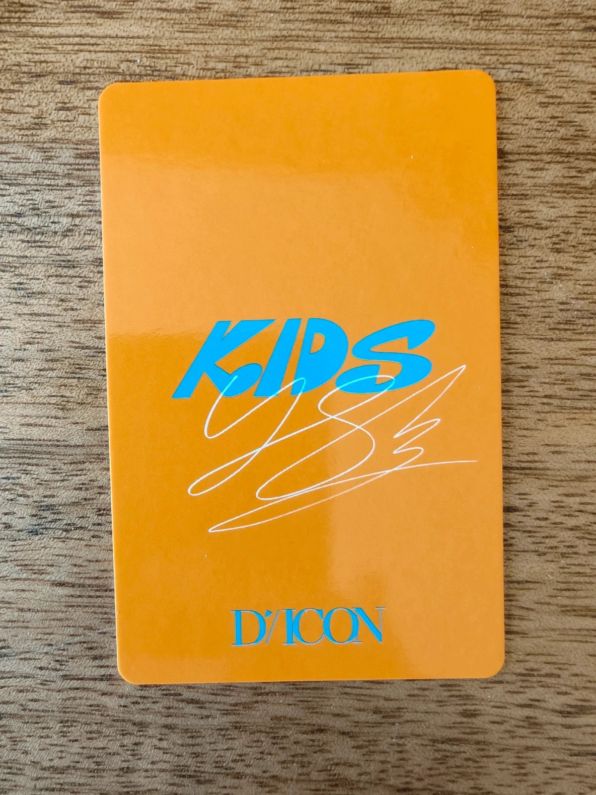 Stray Kids Felix Photocard DICON, orange reverse with blue KIDS lettering