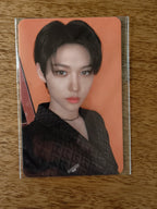 Stray Kids Felix Photocard, dark-haired portrait against an orange background
