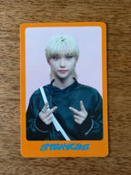 Stray Kids Felix Photocard DICON, blond portrait with two V-sign poses inside an orange border