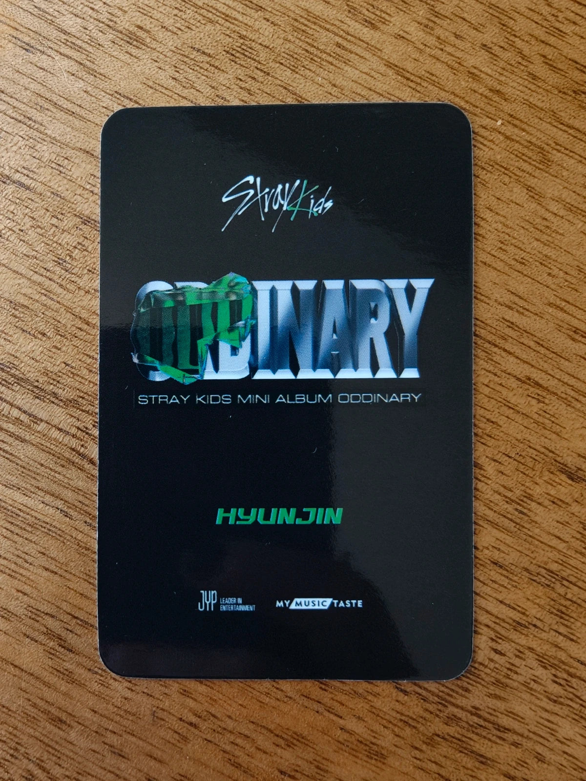 Stray Kids Hyunjin ODDINARY Photocard (MyMusicTaste Video-call Benefit), black reverse with ODDINARY logo and member name
