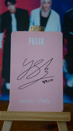 Stray Kids Felix NACIFIC Photocard (Round 4 Pink Lenticular), pink reverse with Felix name and printed signature