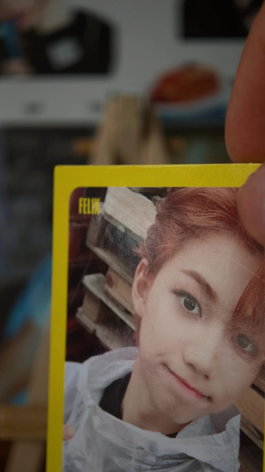 Stray Kids Felix I am WHO Photocard, close-up of the portrait within a yellow border