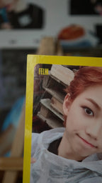 Stray Kids Felix I am WHO Photocard, angled close-up of the yellow-bordered portrait