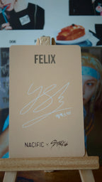 Stray Kids Felix NACIFIC Photocard (Round 9 This Moment) — reverse with printed signature design