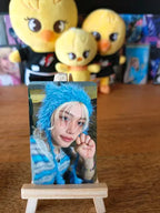 Stray Kids Felix Photocard ATE, portrait wearing a blue character hood